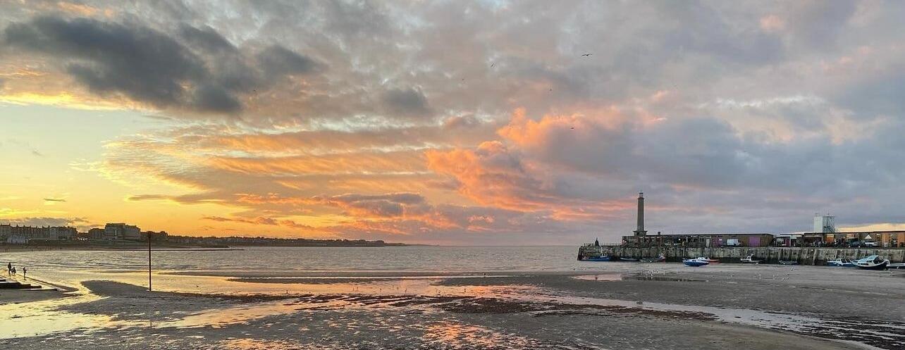 Sunset over Margate harbour and the Main Sands